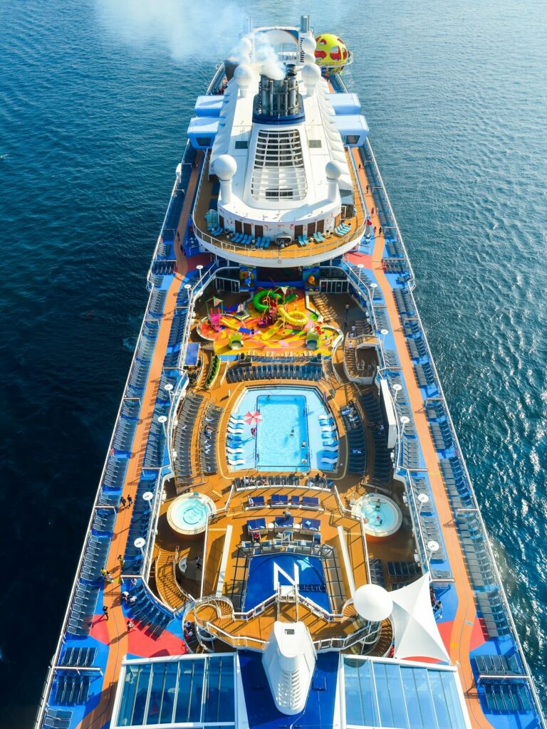 An aerial view of a cruise ship with a pool, perfect for travel enthusiasts.