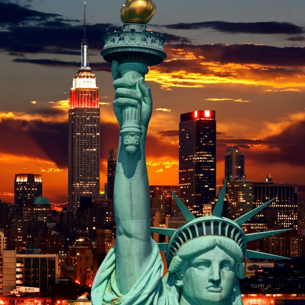 When visiting New York City, make sure to see the iconic Statue of Liberty holding a torch.