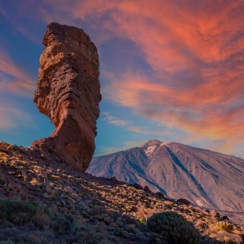 A unique and interesting rock formation in the Tenerife's Teide national park with a mountain in the background.