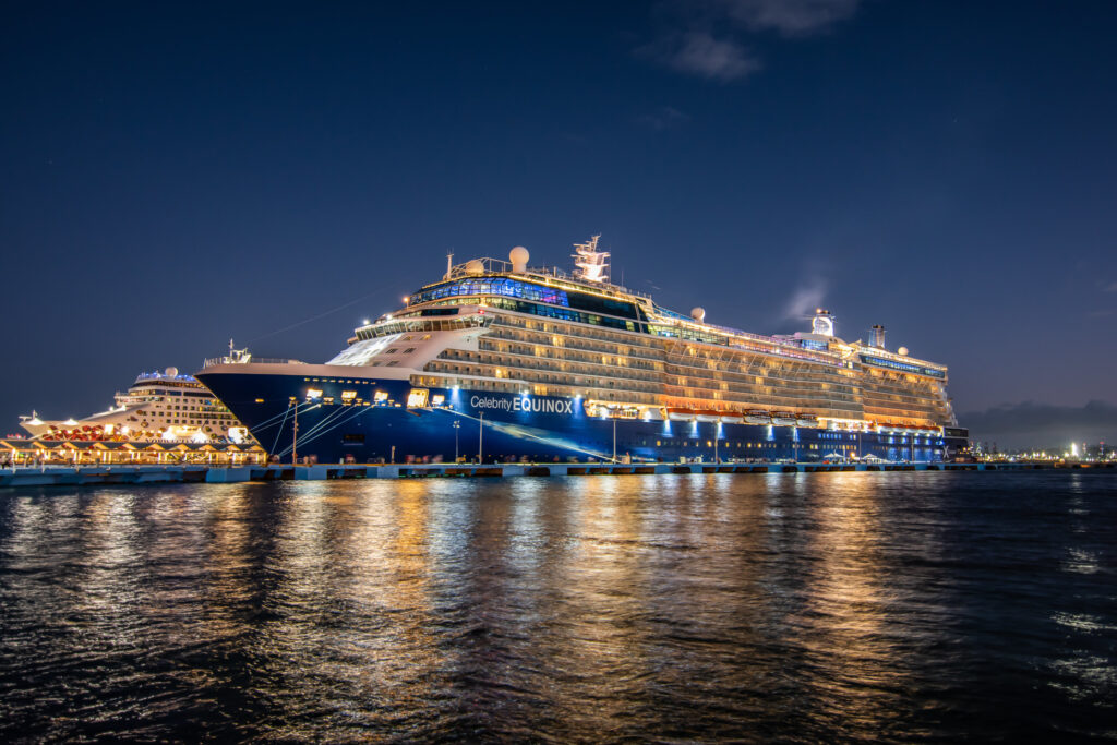 A photo of the Celebrity Equinox cruise ship taken at night.