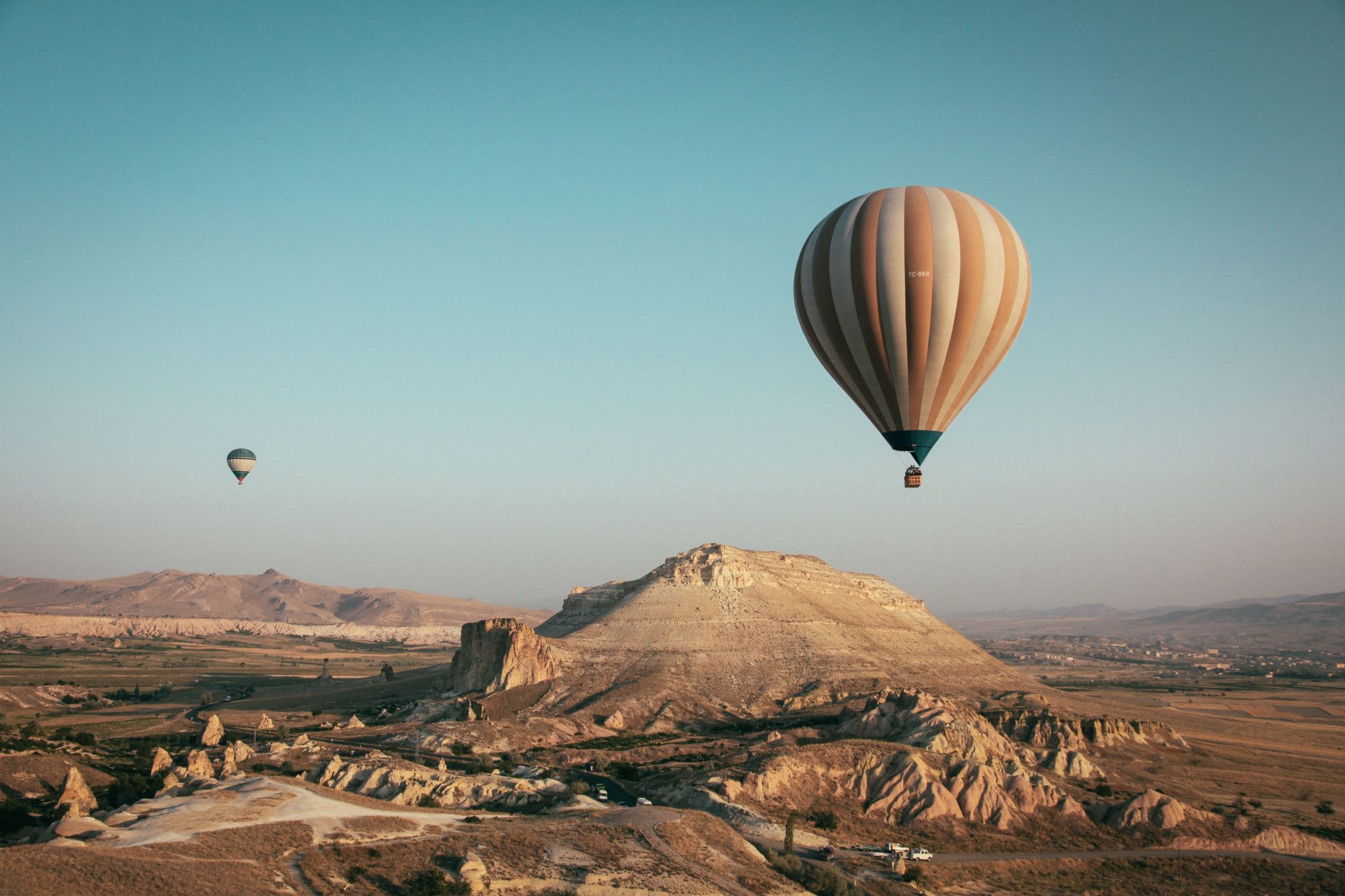 hot air balloon floating over valley of the kings