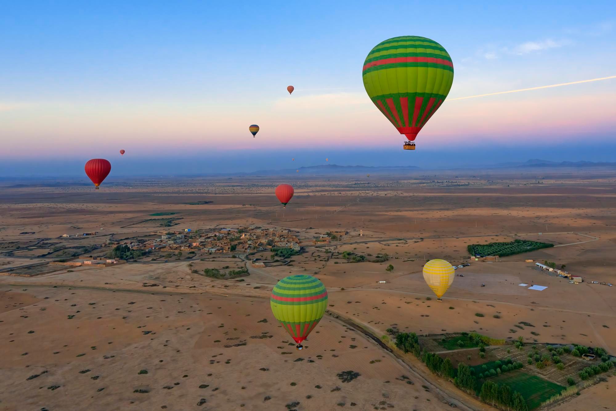 group of hot air balloons over luxor