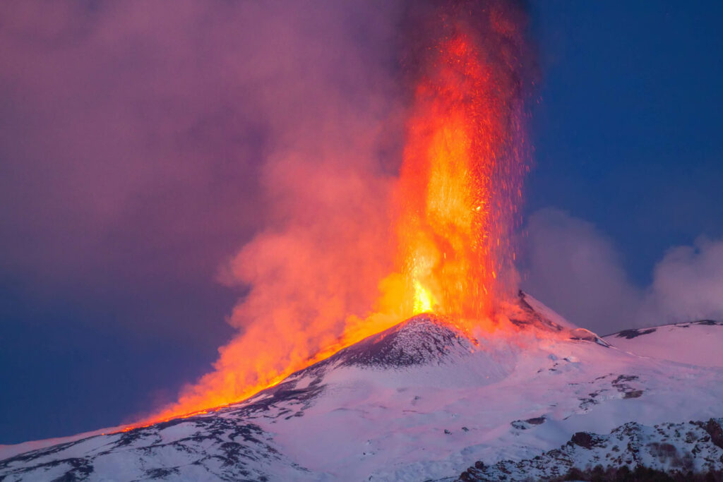 A photo showing the volcanic activity at Mount Etna during a hike.