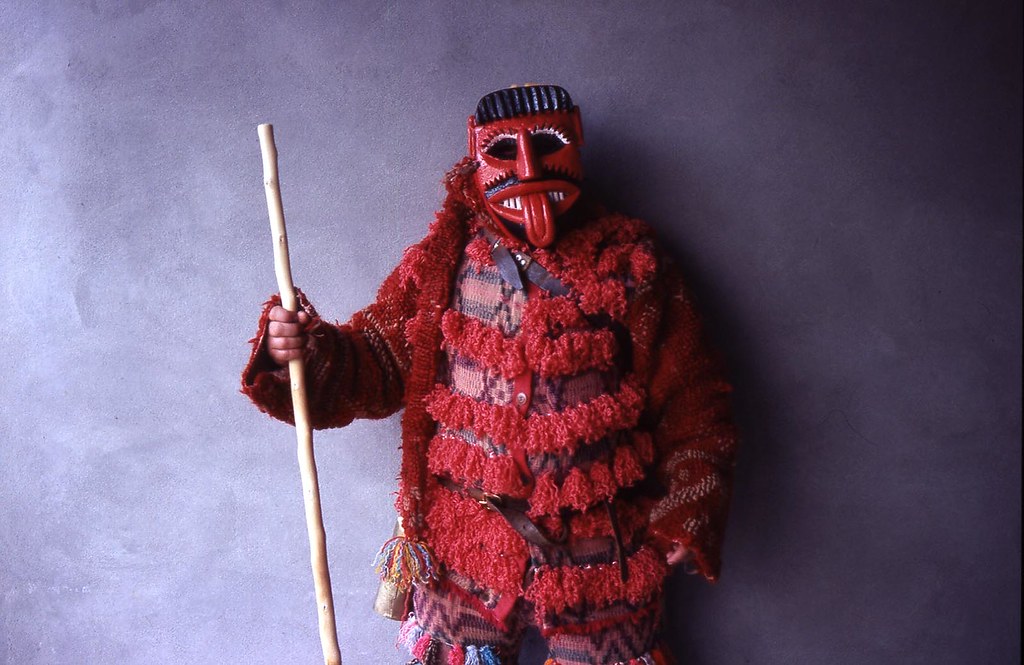 Pagan Portuguese custom, person dressed as a devil with wooden mask and woolen clothing