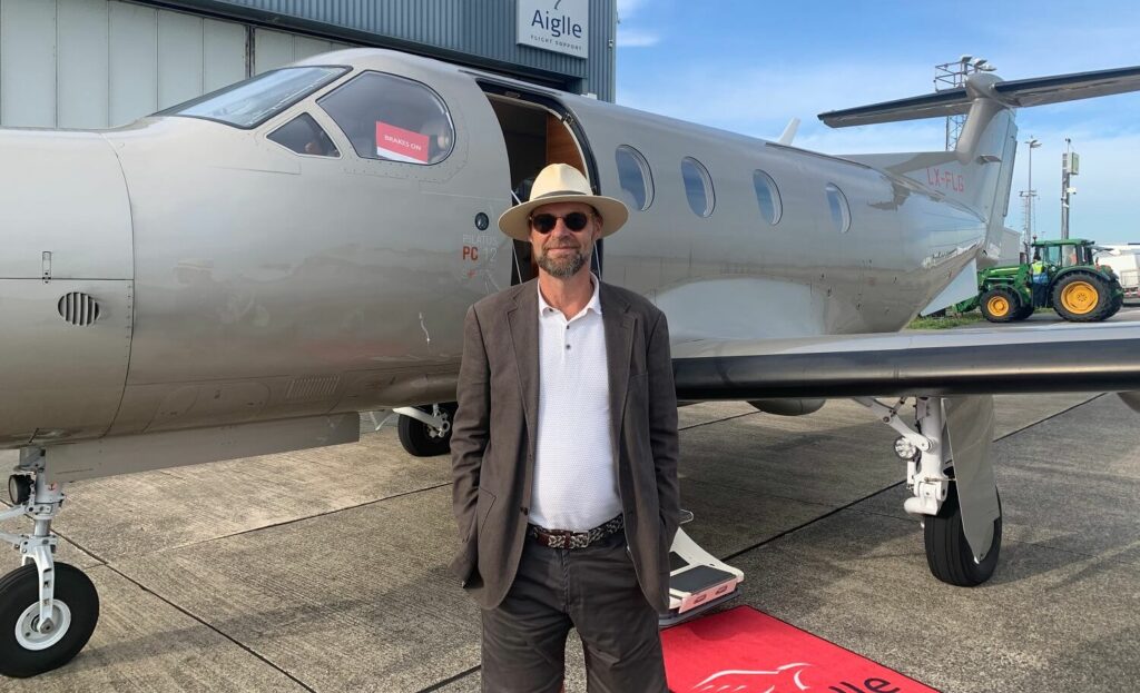 LetsFly General Manager Simon Potter next to his PC12 private aircraft.