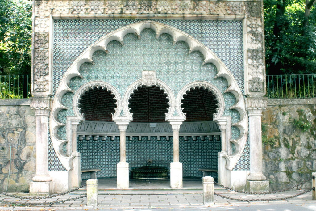 fountain with detailed geometric patterns, carved in stone and blue tiles