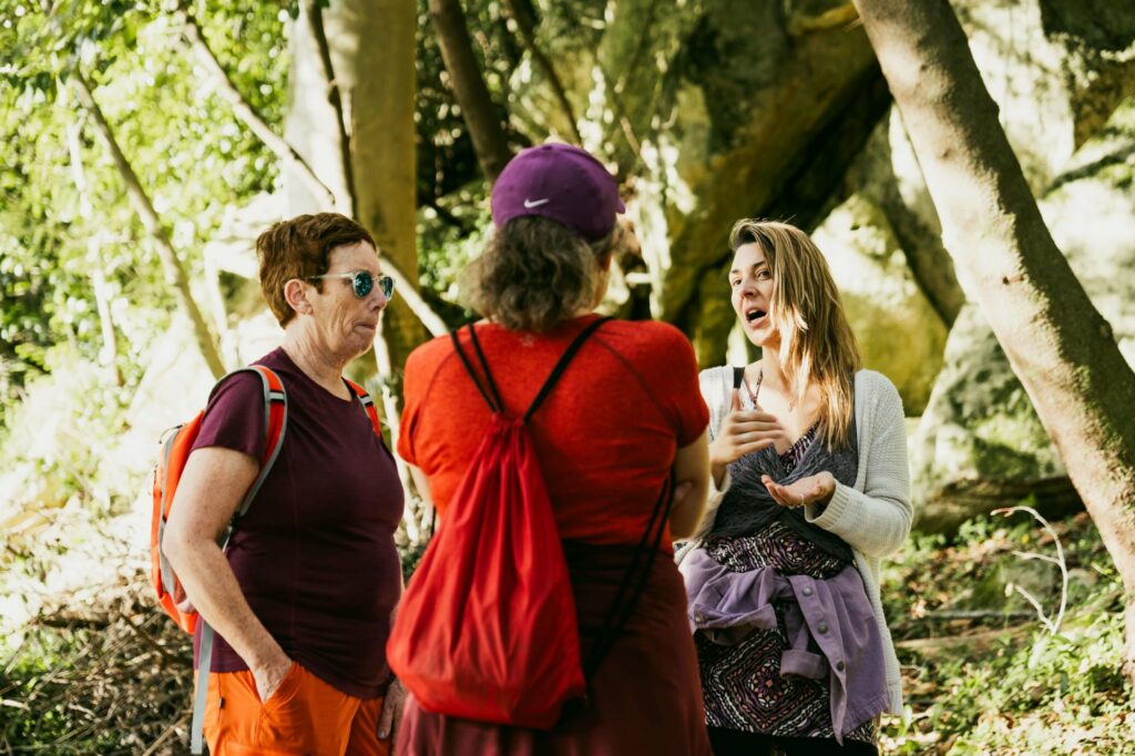 local tour guide talking to guests amongst Sintra's luxurious green forest and hiking trail